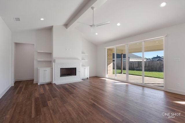 unfurnished living room with dark hardwood / wood-style flooring, lofted ceiling with beams, built in features, and ceiling fan