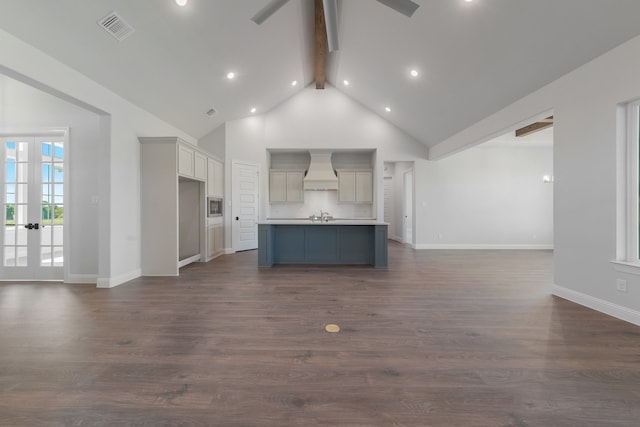 unfurnished living room with high vaulted ceiling, french doors, sink, dark hardwood / wood-style floors, and beamed ceiling