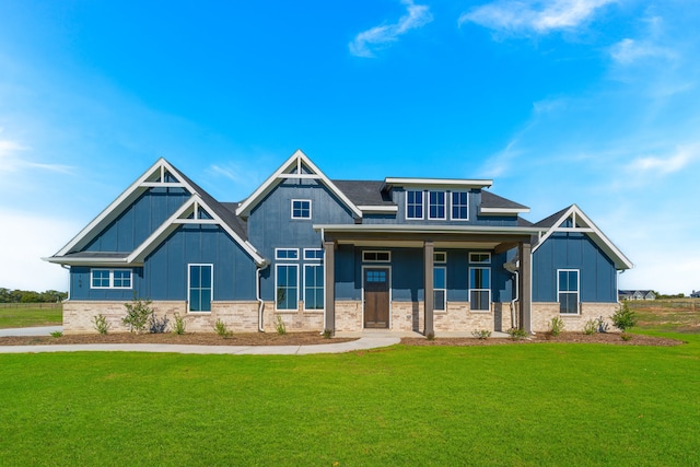 craftsman-style house featuring a front yard and a porch