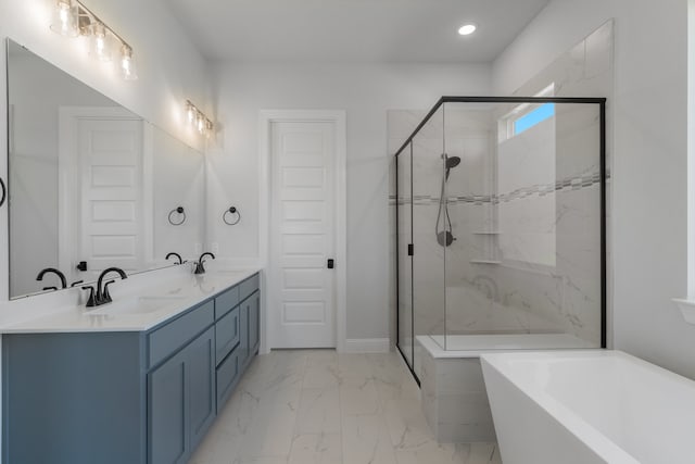 bathroom featuring vanity and shower with separate bathtub