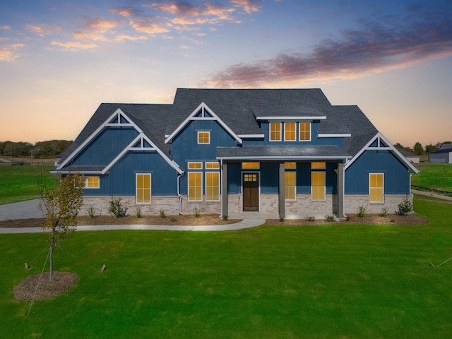 craftsman-style house with a yard