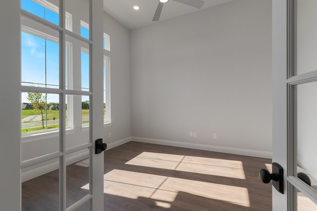 empty room with hardwood / wood-style floors, ceiling fan, and french doors