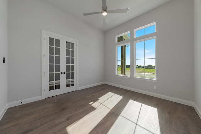 unfurnished room with ceiling fan, french doors, and dark hardwood / wood-style floors