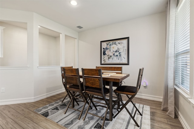 dining area featuring wood-type flooring