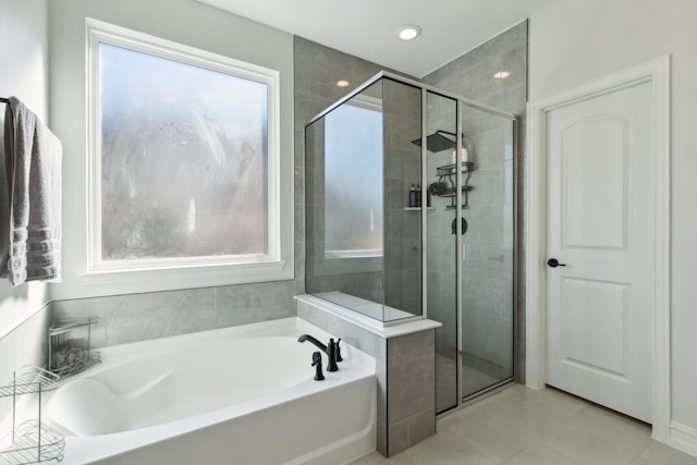 bathroom with separate shower and tub