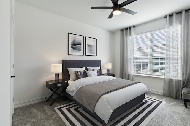 bedroom with ceiling fan and carpet flooring