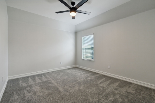 carpeted spare room with lofted ceiling and ceiling fan