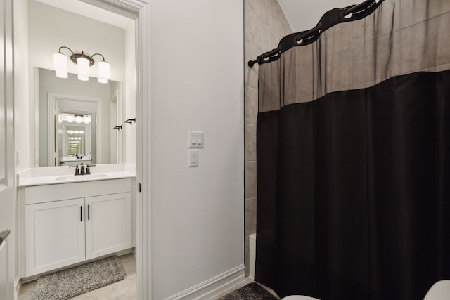 bathroom featuring shower / bath combination with curtain and vanity