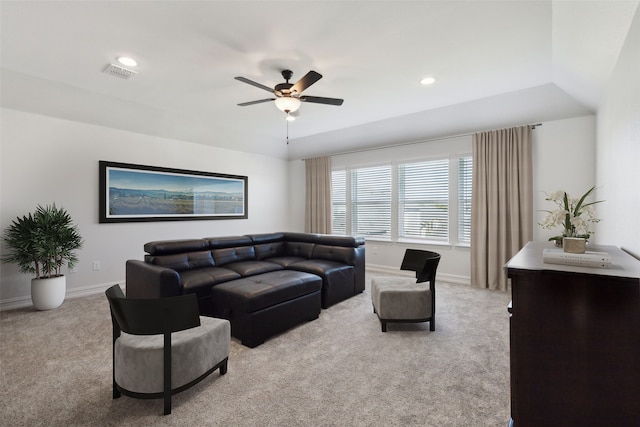 living room featuring light colored carpet and ceiling fan