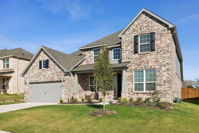 view of front of property with a garage and a front yard