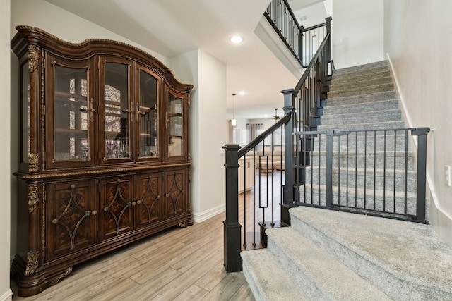 stairway featuring hardwood / wood-style flooring