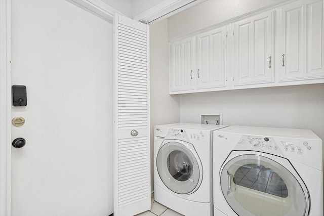 laundry area with cabinet space and washer and clothes dryer