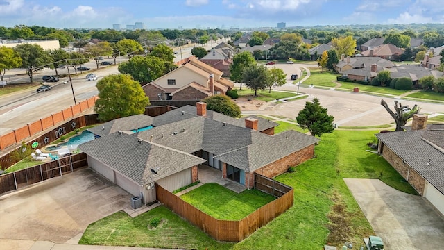 birds eye view of property with a residential view