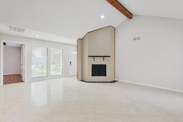 unfurnished living room featuring vaulted ceiling with beams, a fireplace, visible vents, and light tile patterned floors