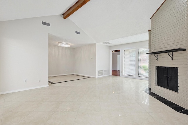 unfurnished living room with visible vents, beamed ceiling, a fireplace, and baseboards