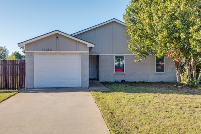 single story home with a garage and a front yard