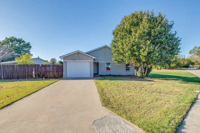 view of front of property with a front lawn and a garage