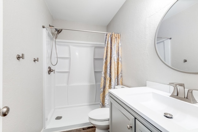 bathroom featuring a shower with curtain, vanity, toilet, and hardwood / wood-style floors