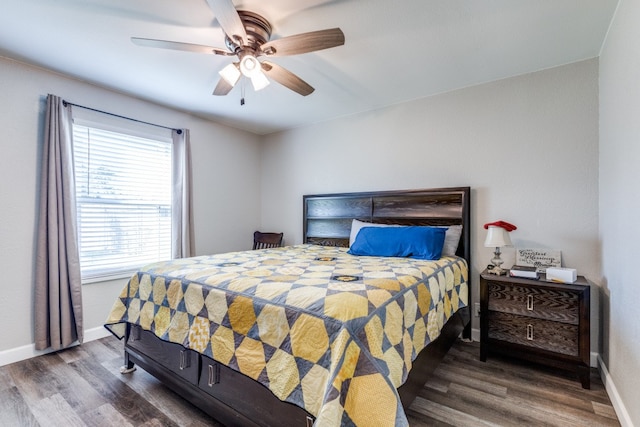 bedroom featuring dark wood-type flooring and ceiling fan