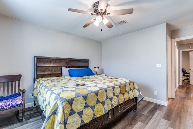 bedroom with hardwood / wood-style flooring and ceiling fan