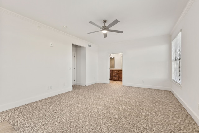 unfurnished bedroom with ceiling fan, connected bathroom, crown molding, and light colored carpet