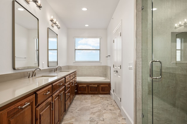 bathroom with shower with separate bathtub and vanity