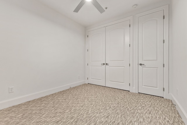 unfurnished bedroom with a closet, light carpet, and ceiling fan