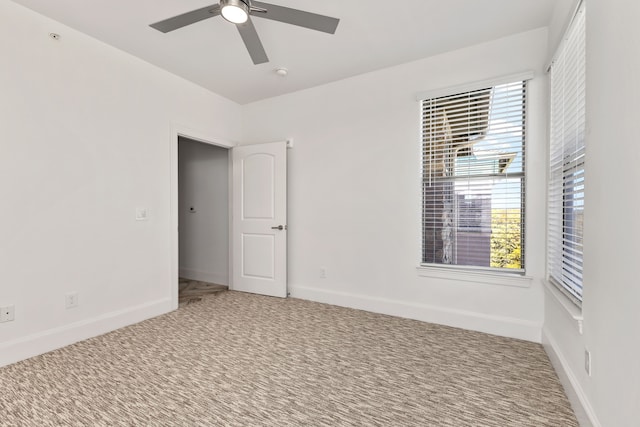 empty room with carpet and ceiling fan