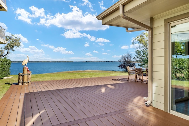 wooden deck with a water view