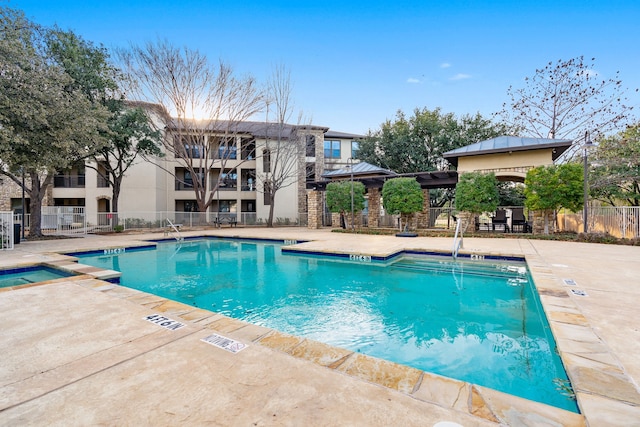 view of swimming pool with a patio area