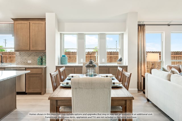 dining room featuring light hardwood / wood-style floors and sink