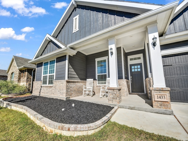 doorway to property with a porch