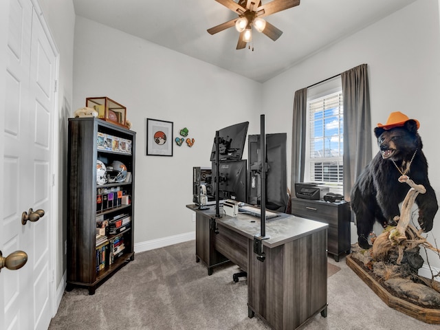 carpeted office featuring ceiling fan