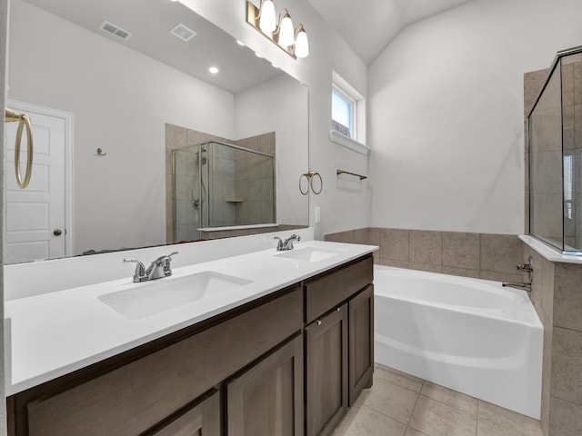 bathroom featuring vanity, tile patterned floors, shower with separate bathtub, and lofted ceiling