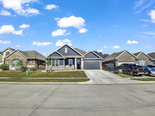 view of front of house featuring a garage and a front lawn