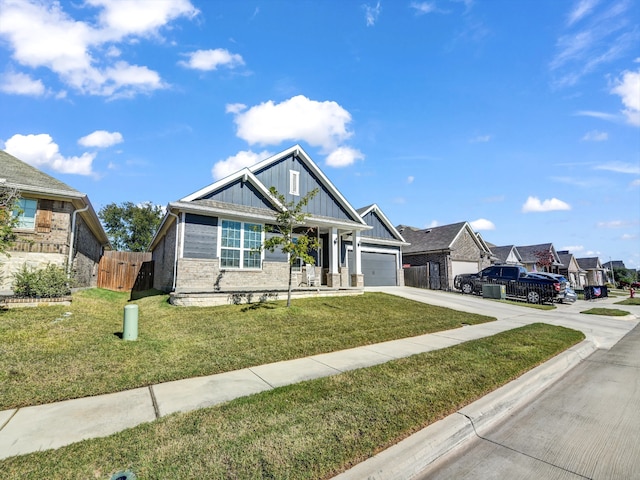 craftsman house with a garage and a front yard