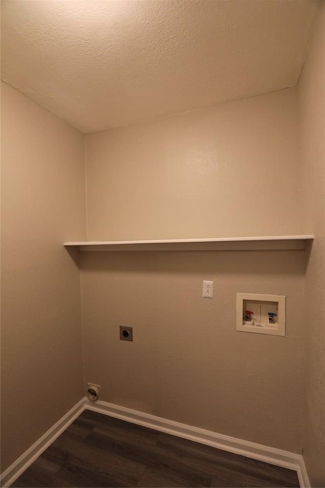 washroom featuring washer hookup, electric dryer hookup, dark hardwood / wood-style flooring, and a textured ceiling