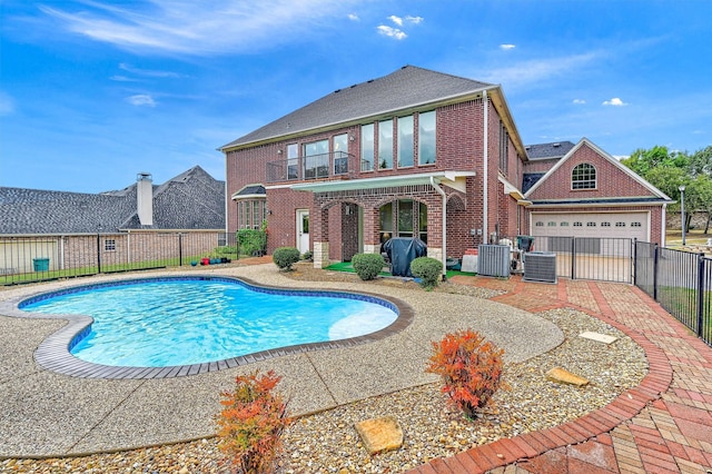 view of swimming pool featuring a patio and central AC