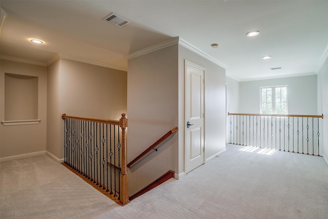 hallway with light carpet and ornamental molding