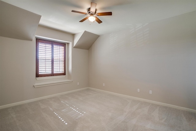 bonus room with light carpet, ceiling fan, and vaulted ceiling