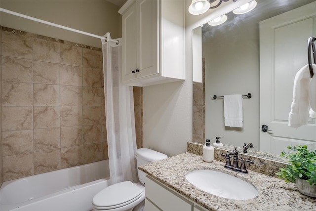 full bathroom featuring shower / bath combo, vanity, and toilet