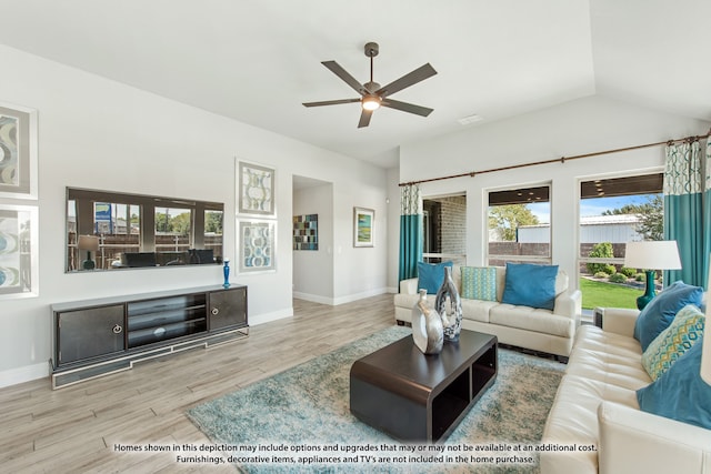 living room featuring light hardwood / wood-style flooring, ceiling fan, and vaulted ceiling