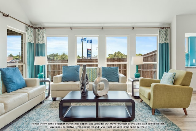 sunroom / solarium with a wealth of natural light and lofted ceiling