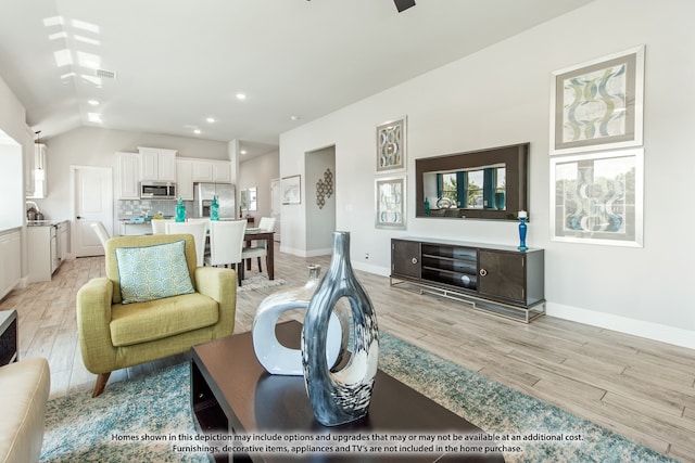 living room with light hardwood / wood-style flooring