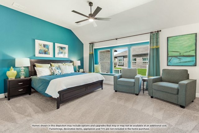 carpeted bedroom with ceiling fan and lofted ceiling