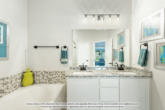 bathroom featuring a bath and vanity