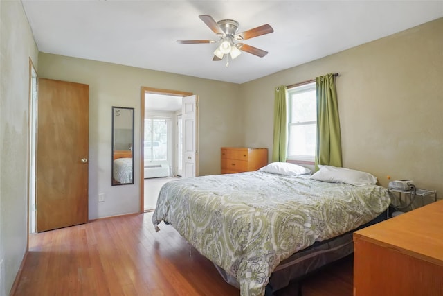 bedroom featuring hardwood / wood-style flooring and ceiling fan