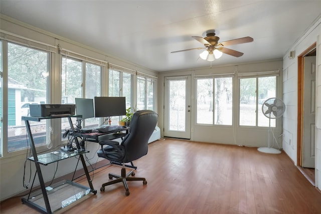 office space with ornamental molding, light hardwood / wood-style flooring, and ceiling fan