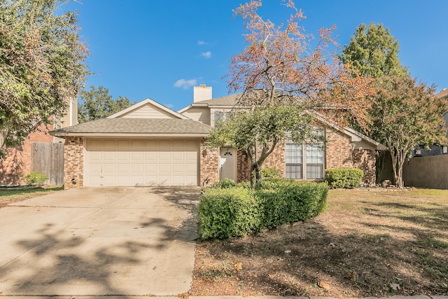 view of front of property with a garage and a front yard