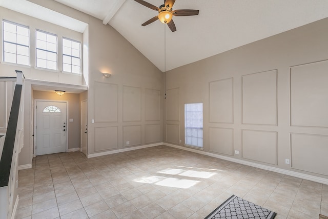 entrance foyer featuring high vaulted ceiling, a healthy amount of sunlight, ceiling fan, and light tile patterned floors